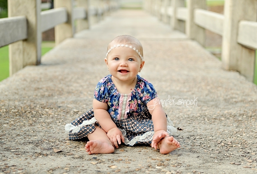 Baby pictures in park on bridge