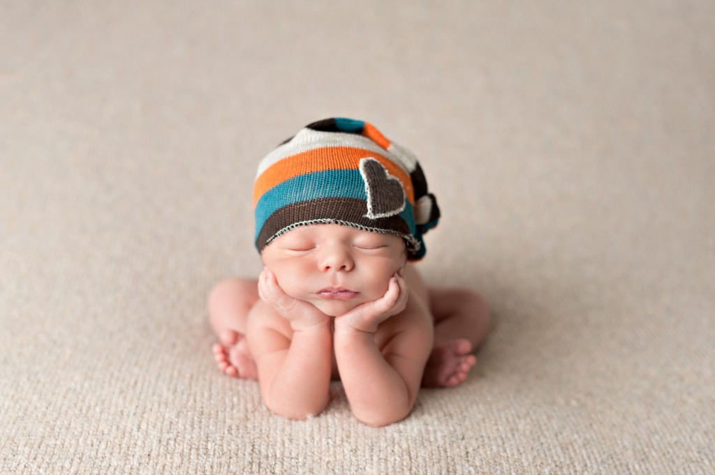 baby propped up in hands pose